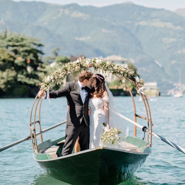 Bride-and-groom-on-Lucia-row-boat-on-Lake-Como
